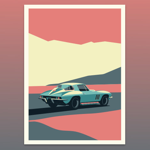 Vintage corvette stingray car on a road with mountains in the background