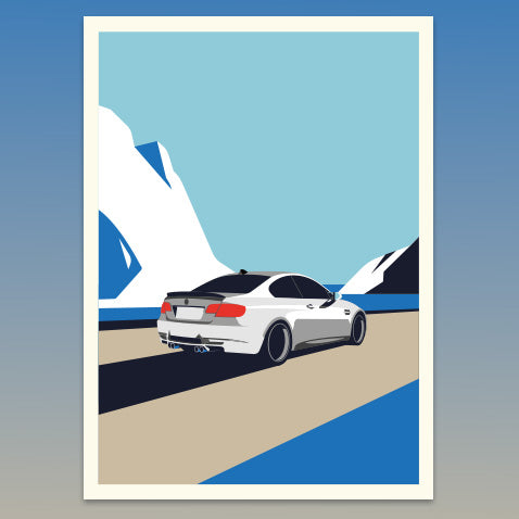 White car on a road with mountains and a sailboat in the background